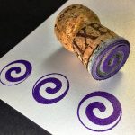 Lasercut spiral stamp mounted on champagne cork