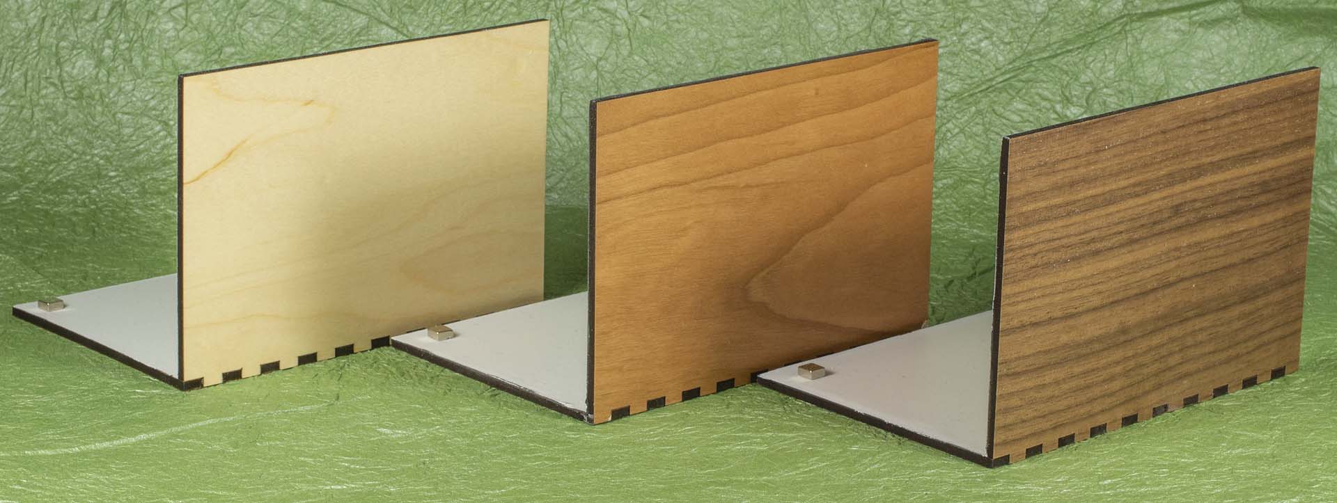Magnetic hardwood pop up card stands in maple, cherry and walnut.