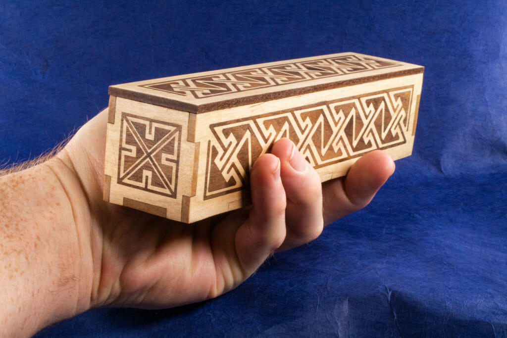 Long Inlaid Celtic Key Pattern Box (hand-held for scale)