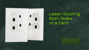 Laser-scoring both sides of a card