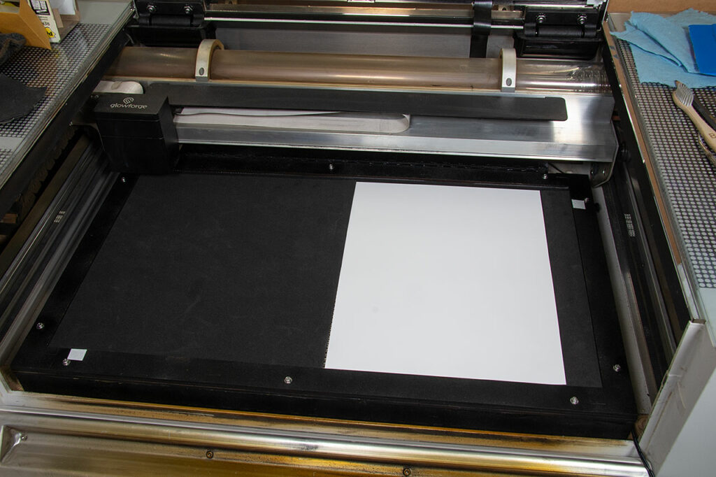 Glowforge vacuum tray in the machine with paper