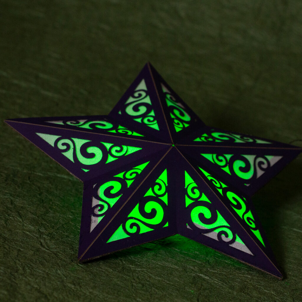 Light-up paper star laying flat
