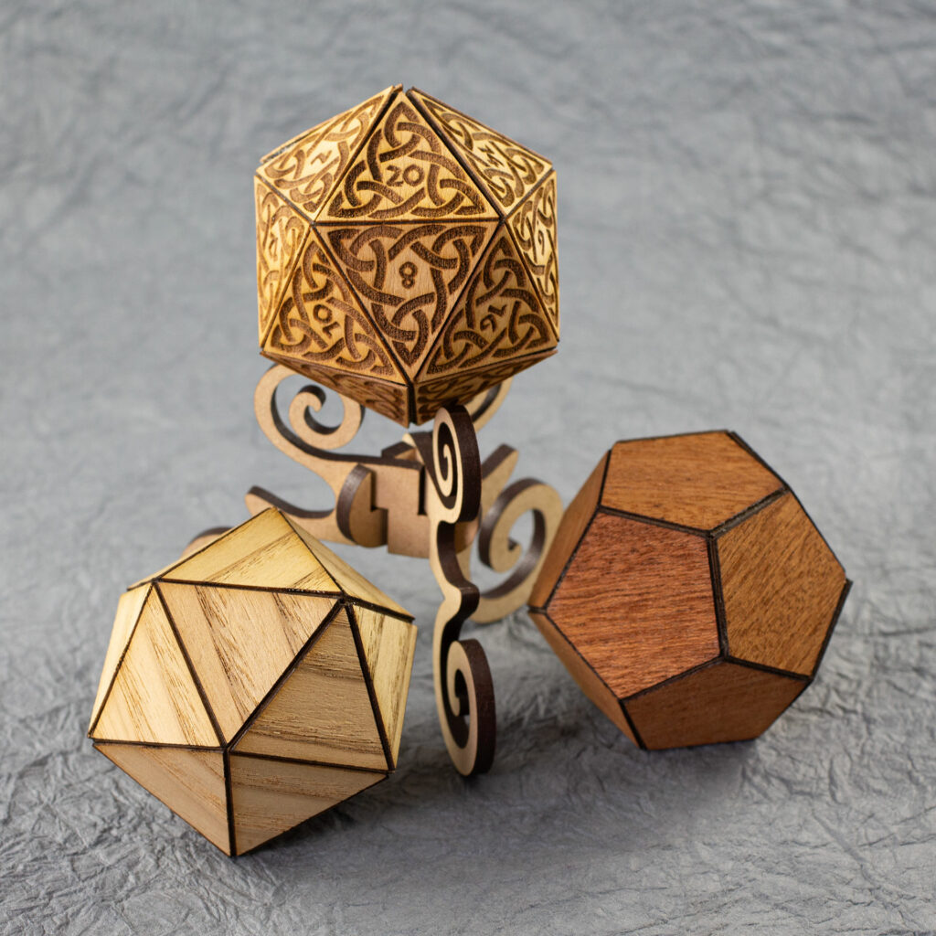 Three wooden polyhedra