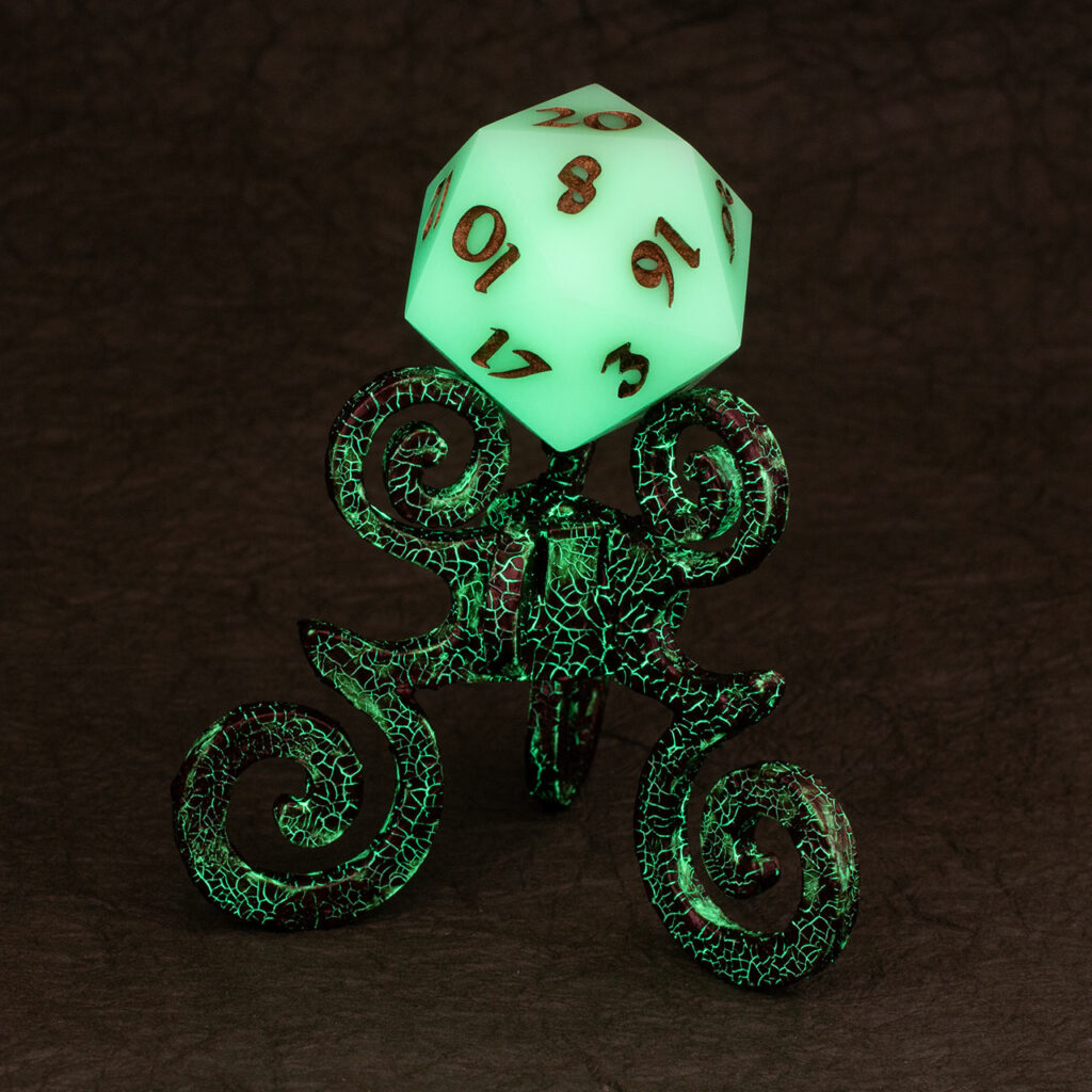 Bronze crackle reliquary with stunt D20 chonk. The cracks in the finish and the D20 are glowing in the dark.