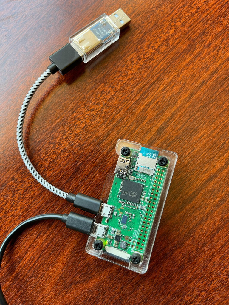 Networked USB drive built with a Raspberry Pi Zero in a laser-cut clear acrylic case.