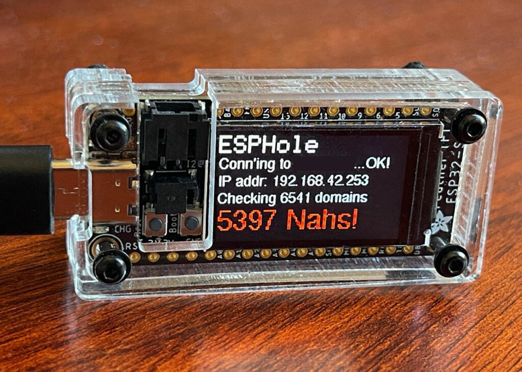 ESP32-S2 TFT Feather running ESPHole in a custom laser-cut acrylic case.