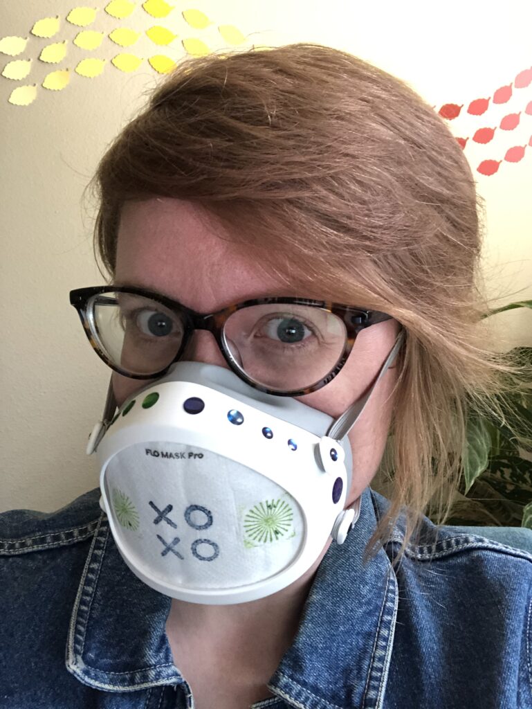 Portrait featuring a Flo Mask whose filter has been stamped with the XOXO stamp in blue