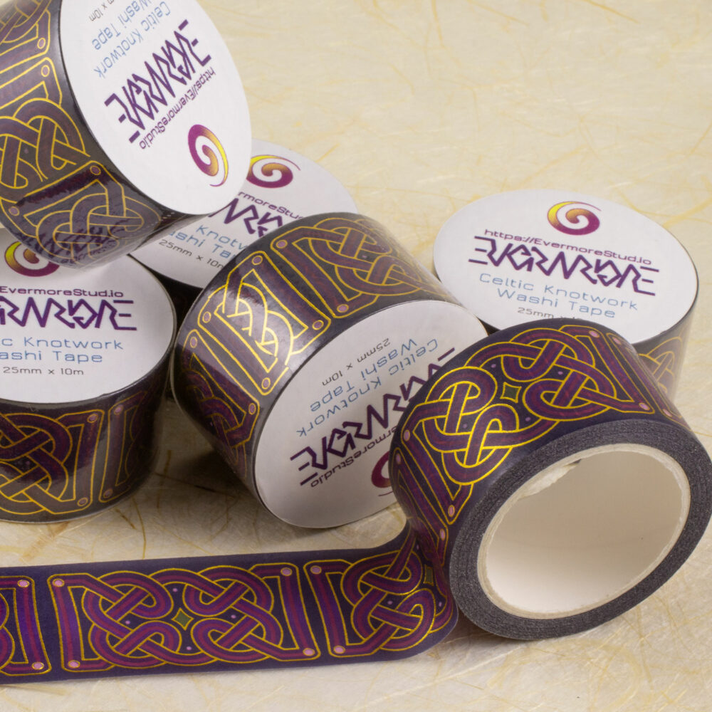 Rolls of 25mm-wide washi tape with Celtic knotwork in shades of purple with gold foil outlines.