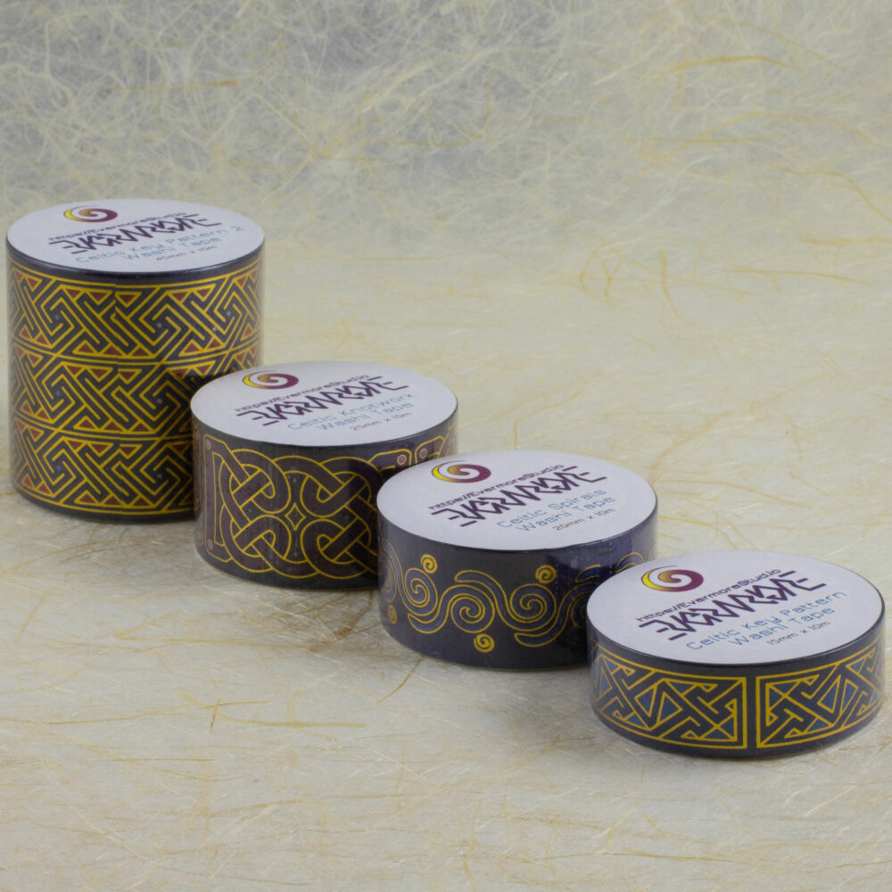 Rolls of four different Celtic art washi tapes ranging from 15mm to 45mm wide lined up in their packaging.