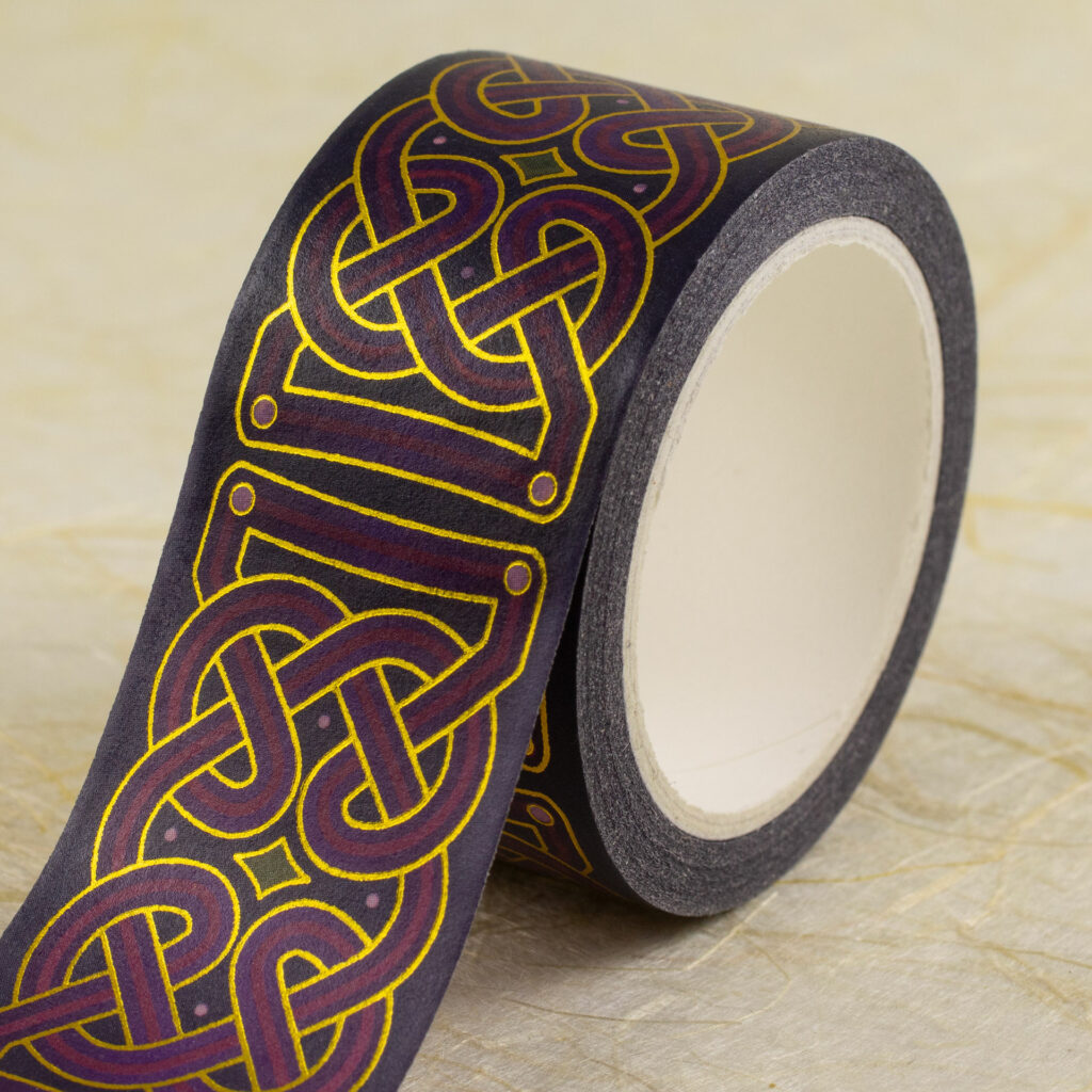 Roll of 25mm-wide washi tape with Celtic knotwork in shades of purple with gold foil outlines.