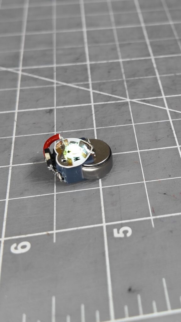 Tiny 3D printed LED light built with an LIR1254 rechargeable battery and a Chibitronics Circuit Sticker