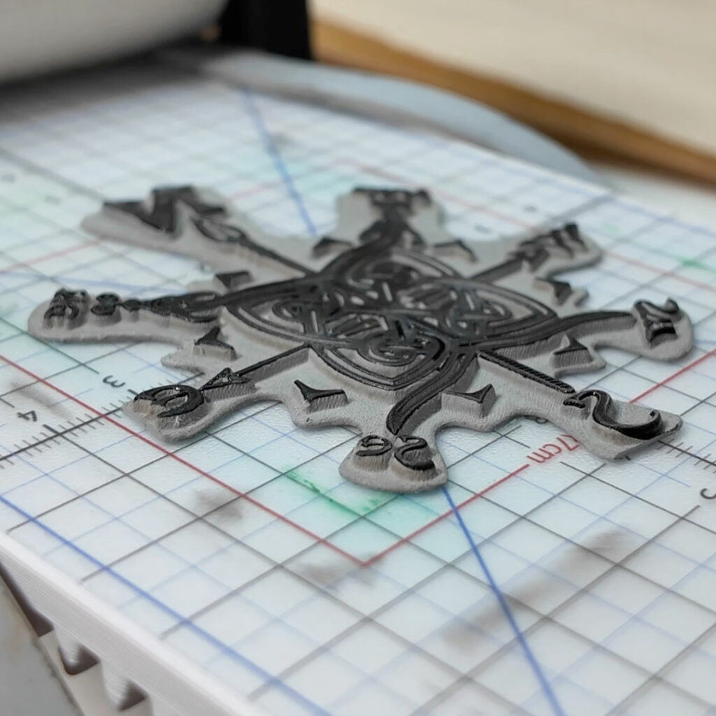 The printing plate for the Dragons Celtic Knotwork Map Compass print on the printing bed